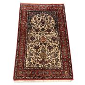 FINE SIGNED ISPHAHAN RUG.