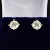 A PAIR OF 18CT GOLD DIAMOND SOLITAIRE STUD EARRINGS.