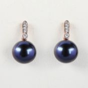 A PAIR OF 9CT ROSE GOLD PEARL AND DIAMOND EARRINGS.