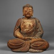 A CARVED AND PAINTED WOOD SEATED FIGURE OF BUDDHA.