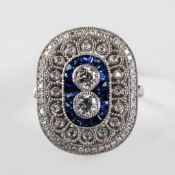 A PLATINUM ART DECO STYLE SAPPHIRE AND DIAMOND RING.