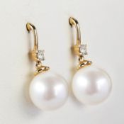 A PAIR OF 9CT GOLD WHITE PEARL AND DIAMOND EARRINGS.