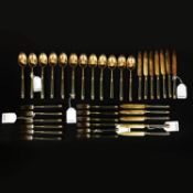 A CRICHTON BROTHERS SET OF SILVER-GILT FRUIT KNIVES, FORKS AND SPOONS. (36).