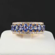 AN 18CT GOLD SAPPHIRE AND DIAMOND DRESS RING.