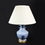 A CHINESE BLUE AND WHITE HU VASE LAMP.
