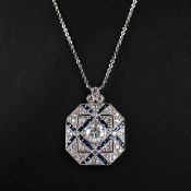 A PLATINUM PANEL STYLE SAPPHIRE AND DIAMOND PENDANT NECKLACE.