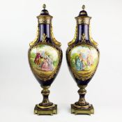 A PAIR OF SEVRES STYLE PEDESTAL URNS AND COVERS.