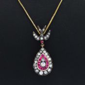 AN 8CT YELLOW AND ROSE GOLD PEAR SHAPED PENDANT.