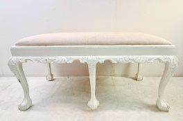 HALL SEAT WITH NEUTRAL LINEN UPHOLSTERY ON PAINTED CLAW AND BALL SUPPORTS.