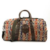 A VIVIENNE WESTWOOD EAGLE PATTERN CANVAS HOLDALL.