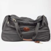 A MULBERRY CANVAS HOLDALL SUITCASE.
