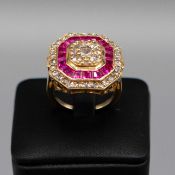 A 14CT GOLD RUBY AND DIAMOND CLUSTER RING.