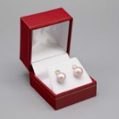 A PAIR OF 18CT GOLD PEARL AND DIAMOND STUD EARRINGS.
