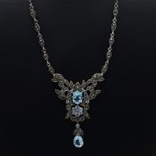 A SILVER AND TOPAZ PENDANT NECKLACE.
