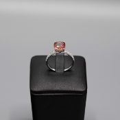 AN 18CT WHITE GOLD TOURMALINE AND DIAMOND DRESS RING.