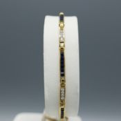 AN 18CT GOLD SAPPHIRE AND DIAMOND BRACELET.