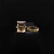 TWO 9CT GOLD RINGS.