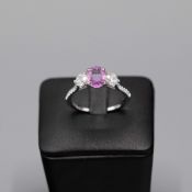 A PLATINUM PINK SAPPHIRE AND DIAMOND TRILOGY RING.