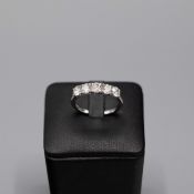 A PLATINUM FIVE STONE DIAMOND RING.