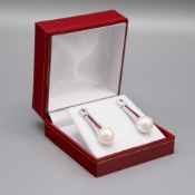A PAIR OF 18CT WHITE GOLD RUBY AND DIAMOND DROP EARRINGS.