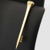 AN HERMES YELLOW METAL TIE PIN.