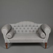 SMALL SOFA WITH BUTTONED BACK LINEN UPHOLSTERY ON TURNED SUPPORTS.