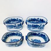 SET OF FOUR BLUE AND WHITE IRON STONE STYLE CERAMIC PLANTERS.
