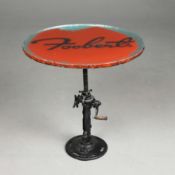 CUSTOM SIDE TABLE WITH GLASS TOP ON INDUSTRIAL CAST IRON BASE.