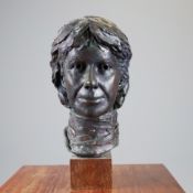 A BRONZE BUST OF A LADY.