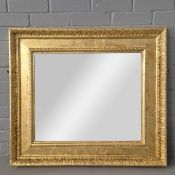 WALL MIRROR WITH BEVELLED PLATE AND GILT FRAME.