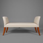 WINDOW SEAT WITH NEUTRAL LINEN UPHOLSTERY ON SABRE SUPPORTS.