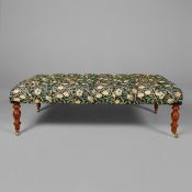 HEARTH STOOL WITH FRUIT TREE PATTERN BUTTONED UPHOLSTERY ON TURNED SUPPORTS.