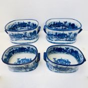 SET OF FOUR BLUE AND WHITE IRONSTONE STYLE CERAMIC PLANTERS.