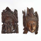 A PAIR OF ASIAN WALL MASKS.