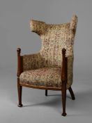EDWARDIAN MAHOGANY AND INLAID WING ARMCHAIR.