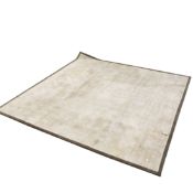 JACARANDA SANTUSHTI SHELL CARPET WITH SUEDE ELEPHANT BORDER.