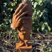 SURREALIST STYLE CAST METAL FACE SCULPTURE.