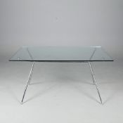 GLASS AND CHROME DINING TABLE.