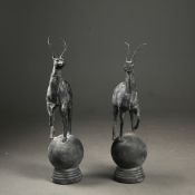 SCULPTURAL STAG FINIALS, A PAIR.