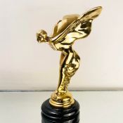 GILT METAL SPIRIT OF ECSTASY SCULPTURE ON A MARBLE BASE.