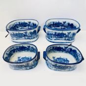 SET OF FOUR BLUE AND WHITE IRONSTONE CERAMIC PLANTERS.
