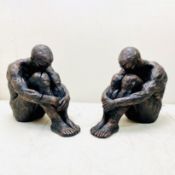 PAIR OF SITTING MEN SCULPTURES