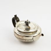 A REGENCY SILVER TEA POT.