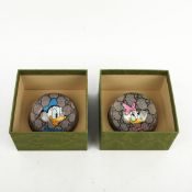 TWO GUCCI GLASS DISNEY 'DONALD DUCK' PAPERWEIGHTS.