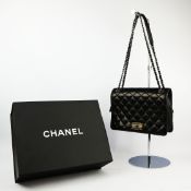 A CHANEL LARGE CALF SKIN BLACK LEATHER FLAPBAG.