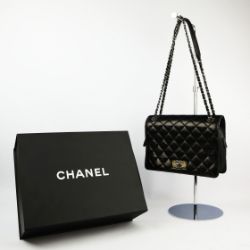 A CHANEL LARGE CALF SKIN BLACK LEATHER FLAPBAG.