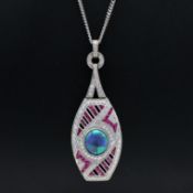 A PLATINUM OPAL, RUBY AND DIAMOND PENDANT NECKLACE.