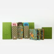 THREE GUCCI DISNEY PENCIL CASE SETS.