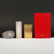 TWO CIGARETTE LIGHTERS AND A CIGAR CUTTER.