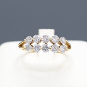 AN 18CT GOLD DIAMOND DRESS RING.